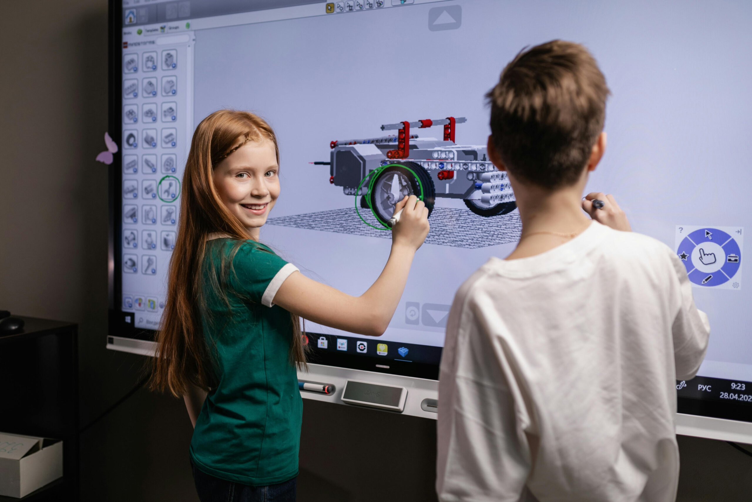 Children using a large touchscreen